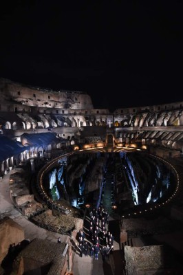 A general view shows the Via Crucis (Way of the Cross) torchlight procession at the Colosseum on Good Friday, on March 30, 2018 in Rome. Christians around the world are marking the Holy Week, commemorating the crucifixion of Jesus Christ, leading up to his resurrection on Easter. / AFP PHOTO / Marco BERTORELLO