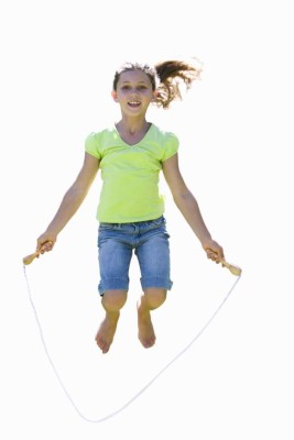 Girl skipping rope, smiling, front view, portrait, cut out