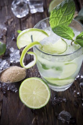 Fresh mojito drink on wooden table