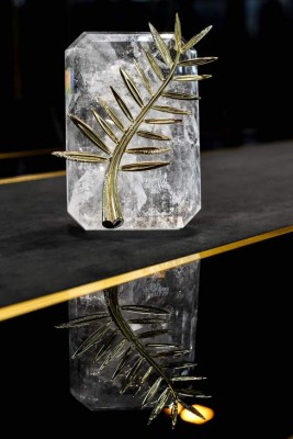 (FILES) This file photo taken on April 26, 2017 in Geneva shows the 70th anniversary special edition of the Palme d'Or trophy pictured ahead of the Cannes Film Festival, during a photocall at the Chopard Jewellery House.For the first time, the Palme d'or 2017, which will award the best film of the official selection on May 28th, will be inlaid with diamonds to celebrate the 70th edition of the Cannes Film Festival. / AFP PHOTO / Fabrice COFFRINI