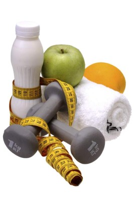 fitness equipment with water and fruits isolated on white