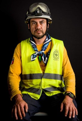 Ismael Villegas, an electric technician who volunteered as a so-called 'Topo' (mole) -- as the diggers who burrow their way into collapsed buildings are known -- after the 7.1 earthquake that hit Mexico on September 19, poses for pictures in Mexico City on September 25, 2017.What struck Villegas the most was that after many trips to help in other countries, he is now helping in his own. A week after an earthquake that killed more than 300 people, a shaken Mexico was torn on September 26 between trying to get back to normal and keeping up an increasingly hopeless search for survivors. / AFP PHOTO / Omar TORRES