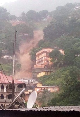 This picture shows flooded streets in Regent near Freetown, on August 14, 2017.The death toll from massive flooding in the Sierra Leone capital of Freetown climbed to 312 on August 14, 2017, the local Red Cross told AFP. Red Cross spokesman Patrick Massaquoi told AFP the toll could rise further as his team continued to survey disaster areas in Freetown, where heavy rains have caused homes to disappear under water and triggered a mudslide. / AFP PHOTO / Society 4 climate change communication Sierra Leone / STR / RESTRICTED TO EDITORIAL USE - MANDATORY CREDIT 'AFP PHOTO / 'S4CCC-SL' - NO MARKETING NO ADVERTISING CAMPAIGNS - DISTRIBUTED AS A SERVICE TO CLIENTS