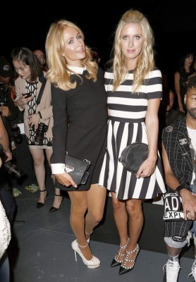 NEW YORK, NY - SEPTEMBER 15: Paris Hilton and Nicky Hilton attend the Michael Costello show during Spring 2016 New York Fashion Week at Pier 59 on September 15, 2015 in New York City. Joe Kohen/Getty Images/AFP== FOR NEWSPAPERS, INTERNET, TELCOS & TELEVISION USE ONLY ==