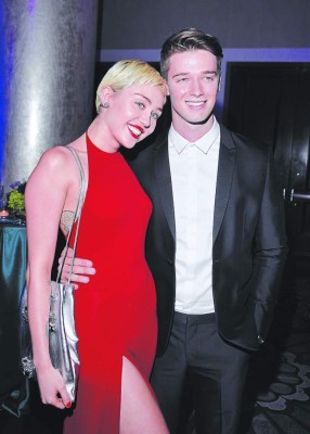 LOS ANGELES, CA - FEBRUARY 07: Recording artist Miley Cyrus (L) and Patrick Schwarzenegger attend the Pre-GRAMMY Gala and Salute to Industry Icons honoring Martin Bandier at The Beverly Hilton Hotel on February 7, 2015 in Los Angeles, California. (Photo by Lester Cohen/WireImage)