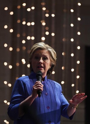 US Democratic presidential nominee Hillary Clinton speaks during a prayer service at the New Mount Olive Baptist Church in Fort Lauderdale, Florida, on October 30, 2016. Polls showed the US election tightening as Hillary Clinton campaigned in the crucial state of Florida, grappling with the fallout from the FBI director disclosing more of her emails were under review. / AFP PHOTO / Jewel SAMAD