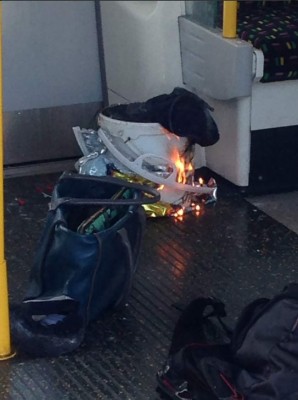 An image taken from a user generated content uploaded on social networks on September 15, 2017, shows a white container burning inside a London Underground tube carriage.Police and ambulance services said they were responding to an 'incident' at Parsons Green underground station in west London on Friday, following media reports of an explosion. A Metro.co.uk reporter at the scene was quoted by the paper as saying that a white container exploded on the train and passengers had suffered facial burns. / AFP PHOTO / @RRIGS / HO / ===RESTRICTED TO EDITORIAL USE - MANDATORY CREDIT 'AFP PHOTO / HO / @RRIGS - NO MARKETING NO ADVERTISING CAMPAIGNS NO ARCHIVES - DISTRIBUTED AS A SERVICE TO CLIENTS FROM FROM ALTERNATIVE SOURCES, THEREFORE AFP IS NOT RESPONSIBLE FOR ANY DIGITAL ALTERATIONS TO THE PICTURE'S EDITORIAL CONTENT, DATE AND LOCATION WHICH CANNOT BE INDEPENDENTLY VERIFIED == /