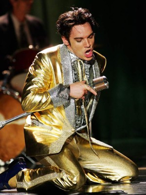 caption: Elvis Presley (Jonathan Rhys Meyers) performs one of his songs wearing his famous gold lame suit, in ELVIS, a four-hour mini-series which will be broadcast as the 'CBS Sunday Movie,' Sunday, May 8 (9:00-11:00 p.m. ET/PT) and Wednesday, May 11 (8:00-10:00 p.m. ET/PT) on the CBS Television Network. Photo: Monty Brinton/CBS?2005 CBS Broadcasting Inc. All Rights Reservedcopyright: ?2005 CBS Broadcasting Inc. All Rights Reserved CBS ELVISCBS STF