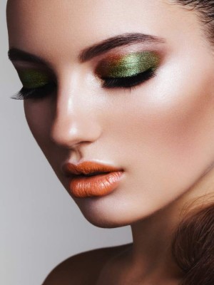 Studio beauty portrait of woman with professional make-up. High-end retouch.