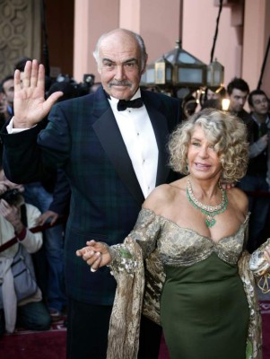 (FILES) In this file photo taken on December 07, 2004 British actor Sean Connery and his wife, Micheline Roquebrune, arrive for the presentation of 'Alexendre,' directed by Oliver Stone, during the 44th International Film Festival in Marrakesh. - Legendary British actor Sean Connery, best known for playing fictional spy James Bond in seven films, has died aged 90, his family told the BBC on on October 31, 2020. The Scottish actor, who was knighted in 2000, won numerous awards during his decades-spanning career, including an Oscar, three Golden Globes and two Bafta awards. (Photo by Jack GUEZ / AFP)
