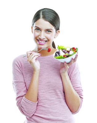 Studio portrait of a beautiful young woman eating a healthy salad
