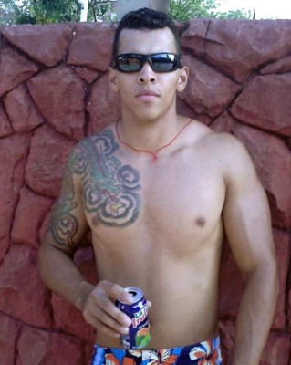 A family poses for a photo next to the statue of Hulk at a park in Ixhuatlancillo community, Veracruz state, Mexico on January 4, 2018.Seven superheroes of DC Comics and Marvel jumped from the big screen and the comic pages to be immortalized in this poor community of the Mexican state of Veracruz, which is now guarded by the representations of popular characters like Captain America, Batman, Iron Man and Wonder Woman, triggering criticism against a former mayor. / AFP PHOTO / JOSE CASTAÑARES