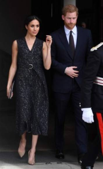 Britain's Prince Harry (R) and his US fiancee Meghan Markle leave after attending a memorial service at St Martin-in-the-Fields in Trafalgar Square in London, on April 23, 2018, to commemorate the 25th anniversary of the murder of Stephen Lawrence.<br/>Prince Harry attended a memorial on Monday marking the 25th anniversary of the racist murder of black teenager Stephen Lawrence in a killing that triggered far-reaching changes to British attitudes and policing. The prince and his fiancee Meghan Markle joined Stephen's mother Doreen Lawrence, who campaigned tirelessly for justice after her son was brutally stabbed to death at a bus stop on April 22, 1993. / AFP PHOTO / POOL / Victoria Jones