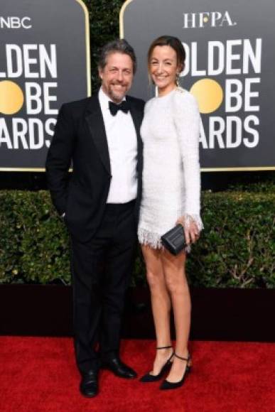 BEVERLY HILLS, CA - JANUARY 06: Hugh Grant (L) and Anna Elisabet Eberstein attend the 76th Annual Golden Globe Awards at The Beverly Hilton Hotel on January 6, 2019 in Beverly Hills, California. Frazer Harrison/Getty Images/AFP