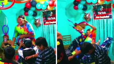 Momento cuando cae el payaso encima de la torta.