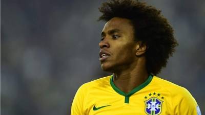 Chelsea's Willian, celebrates scoring his side's first goal of the game during the Champions League round of sixteen first leg soccer match between FC Barcelona and Chelsea at Stamford Bridge stadium in London, Tuesday, Feb. 20, 2018. (Adam Davy/PA via AP)