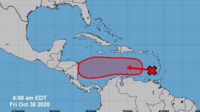 Fotografía satelital donde se muestra la localización de la onda tropical en el Caribe. EFE