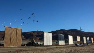 Eigth prototypes of US President Donald Trump's US-Mexico border wall being built near San Diego, in the US, are seen from across the border from Tijuana, Mexico, on October 22, 2017. Following up on President Donald Trump's campaign promise to build a wall along the entire 3,200 kilometre (2,000 mile) Mexican frontier, the Department of Homeland Security began building prototypes for the barrier along the border in San Diego and Imperial counties, as it announced in August. / AFP PHOTO / GUILLERMO ARIASGUILLERMO ARIAS/AFP/Getty Images