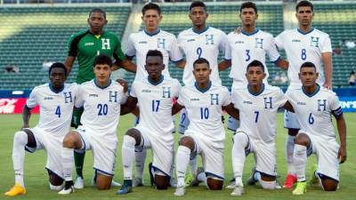 El once titular con el que salió Honduras en el debut contra Haití en el Preolímpico de la Concacaf. Fotos AFP