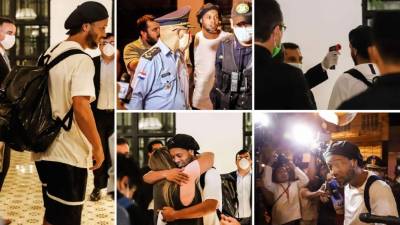 El exfutbolista brasileño Ronaldinho y su hermano Roberto abandonaron la cárcel e ingresaron en un exclusivo hotel de Asunción donde cumplirán arresto domiciliario por entrar al país con pasaportes paraguayos falsos. Fotos AFP y EFE