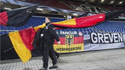 Germany's defender Nico Schulz (2ndL) celebrates with teammates after scoring their third goal during the UEFA Euro 2020 Group C qualification football match between The Netherlands and Germany at the Johan Cruyff Arena in Amsterdam on March 24, 2019. (Photo by JOHN THYS / AFP)
