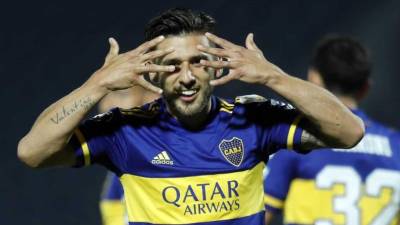 Eduardo 'Toto' Salvio celebrando uno de sus goles contra el Libertad de Paraguay. Foto AFP