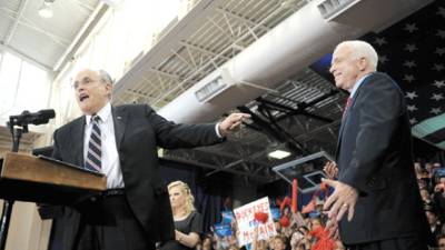 Former New York mayor Rudolph Guiliani (L) introduces US Republican presidential candidate John McCain at a campaign rally at United High School in Hanoverton, Ohio, on October 31, 2008. McCain is on the second day of his two-day bus tour of Ohio, four days before the elction. AFP PHOTO/Robyn BECK