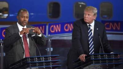 El Dr. Carson le pisa los talones a Donald Trump en los sondeos de intención de voto del partido republicano.