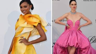 La modelo Jasmine Tookes impacta con un vestido amarillo degradado con pierna al descubierto. Y Coco Rocha es un vestido 'cola de pato' en rosa. Fotos AFP y EFE