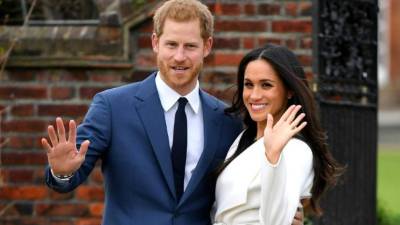 El príncipe Harry de Gales junto a su prometida Meghan Markle.