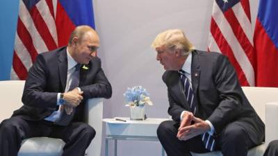 El presidente ruso, Vladímir Putin, con el presidente estadounidense, Donald J. Trump. EFE