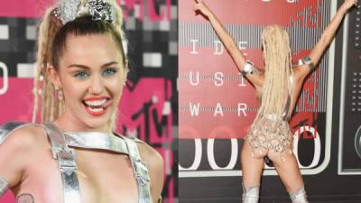 Miley Cyrus llegó a la alfombra de los MTV prácticamente sin ropa interior en un look plateado de Jeremy Scott.
