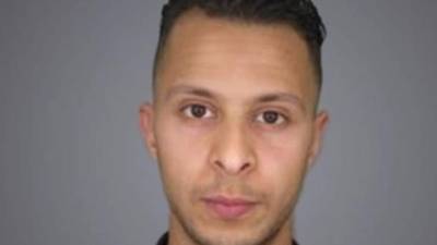 (FILES) In this file photo taken on February 5, 2018 the prime suspect in the November 2015 Paris attacks Salah Abdeslam (L) sits beside his alleged accomplice Sofiane Ayari (R) as they are surrounded by Belgian special police officers in the courtroom at the 'Palais de Justice' courthouse in Brussels for the opening of his trial.A Belgian court on April 23, 2018 sentenced Salah Abdeslam, the last surviving suspect in the Paris attacks, to 20 years in prison for terrorism-related attempted murder over a shootout with police in Brussels days before his capture in 2016. The court passed the same sentence on Abdeslam's accomplice co-defendant Sofiane Ayari, saying there was no doubt about their involvement in extremism. Four police officers were wounded in the gun battle during a raid on a flat in the Forest area of Brussels on March 15, 2016. / AFP PHOTO / Emmanuel DUNAND