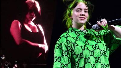 Billie Eilish dejó ver su figura en un top negro.