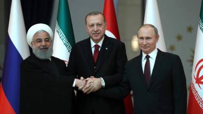 El presidente de Irán, Hasán Rouhaní, el presidente turco Recep Tayyip Erdogan y el presidente ruso Vladimir Putin. AFP