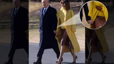 Trump trata de coger de la mano a Melania. No se da cuenta de que ésta lleva sobre los hombros un abrigo mostaza de Ralph Lauren, y solo agarra la manga vacía.