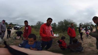 LA JOYA, TEXAS - APRIL 13: A Central American family boards a U.S. Customs and Border Protection bus for transport to an immigrant processing center after crossing the border from Mexico on April 13, 2021 in La Joya, Texas. A surge of immigrants crossing into the United States, including record numbers of children, has challenged U.S. immigration agencies along the southern border. John Moore/Getty Images/AFP== FOR NEWSPAPERS, INTERNET, TELCOS & TELEVISION USE ONLY ==