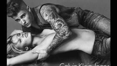 Justin Bieber y Lara Stone en una sexi imagen.