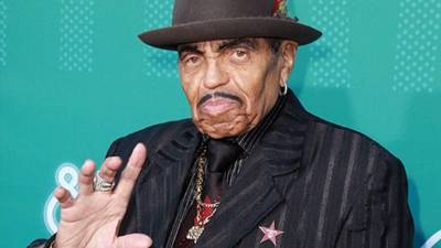 FILE - In this March 4, 2005, file photo, music producer Joseph Jackson, father of pop star Michael Jackson, appears at a news conference in Lindlar near Cologne, western Germany. Jackson was buried Monday, July 2, 2018, in the same Southern California cemetery as his late son Michael. (AP Photo Hermann J. Knippertz, File)