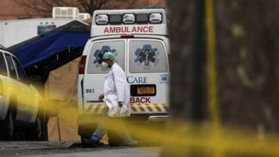 Police medic Mike Seltzer disinfects an ambulance at the Nassau County Police Department in Mineola, New York, on May 15, 2020. - Nassau County on Long Island reported the second highest number of COVID-19 cases after New York and Nassau County Police Medics are the primary providers of pre-hospital emergency care for the County. (Photo by Angela Weiss / AFP)