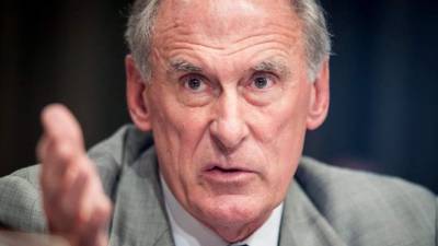 (FILES) In this file photo taken on February 13, 2018 Director of National Intelligence Dan Coats testifies on worldwide threats during a Senate Intelligence Committee hearing on Capitol Hill in Washington, DC.The threat of cyberattacks against the US is at a 'critical point,' the country's intelligence chief has warned, branding Russia the most 'aggressive foreign actor' ahead of President Donald Trump's meeting with Vladimir Putin. 'The warning signs are there. The system is blinking. It is why I believe we are at a critical point,' national intelligence director Dan Coats said July 13, 2018 at an event in Washington. / AFP PHOTO / SAUL LOEB