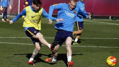 Lionel Messi y Jérémy Mathieu, en un entrenamiento de la semana del Barcelona. Foto FCBarcelona.com