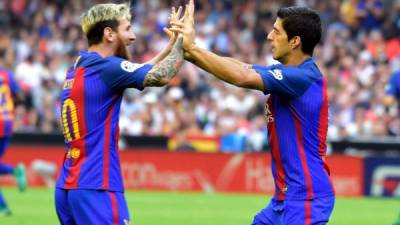 Lionel Messi y Luis Suárez comandan, de momento, la tabla de goleadores de la Liga española. Foto AFP