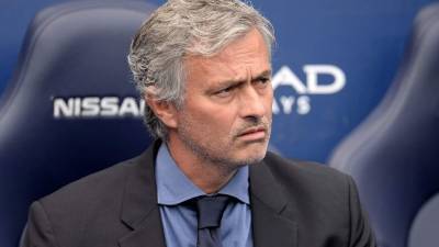 Manchester United's Portuguese manager Jose Mourinho looks on during the start of a last 16 second leg UEFA Champions League football match between Manchester United and Sevilla at Old Trafford in Manchester, northwest England on March 13, 2018. / AFP PHOTO / Oli SCARFF