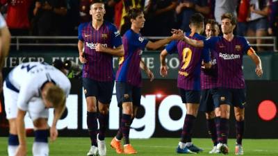 Jugadores del Barcelona festejando uno de los goles ante Tottenham. FOTO AFP.