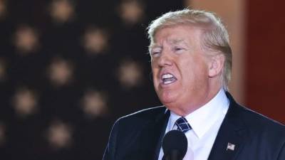 US President Donald Trump speaks to the press before departing the White House for the G7 summit in Washington, DC, on June 8, 2018. / AFP PHOTO / NICHOLAS KAMM