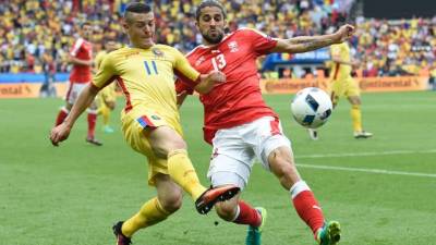 El duelo fue apretado de principio a fin. Foto AFP.