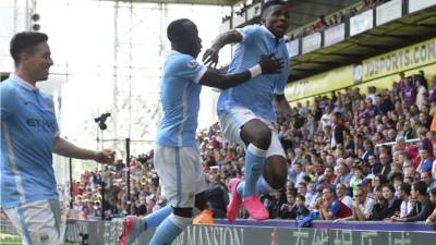 Manchester City's French defender Benjamin Mendy (L) reacts at the final whistle during the English Premier League football match between Manchester City and Crystal Palace at the Etihad Stadium in Manchester, north west England, on January 18, 2020. (Photo by Oli SCARFF / AFP) / RESTRICTED TO EDITORIAL USE. No use with unauthorized audio, video, data, fixture lists, club/league logos or 'live' services. Online in-match use limited to 120 images. An additional 40 images may be used in extra time. No video emulation. Social media in-match use limited to 120 images. An additional 40 images may be used in extra time. No use in betting publications, games or single club/league/player publications. /