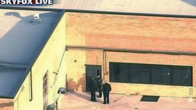 DAYTON, OHIO - AUGUST 04: A police officer pulls down crime scene tape to allow some traffic to begin to flow around the Oregon District as the investigation into a mass shooting in the popular nightlife district continues on August 04, 2019 in Dayton, Ohio. At least 9 people were reported to have been killed and another 27 injured when a gunman identified as 24-year-old Connor Betts opened fire with a AR-15 style rifle. The shooting comes less than 24 hours after a gunman in Texas opened fire at a shopping mall killing at least 20 people. Scott Olson/Getty Images/AFP== FOR NEWSPAPERS, INTERNET, TELCOS & TELEVISION USE ONLY ==