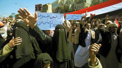 Anti-government protestors chant slogans during a demonstration demanding the resignation of Yemeni President Ali Abdullah Saleh, in Sanaa, Yemen, Saturday, Feb. 26, 2011. Yemeni security forces opened fire on thousands of demonstrators in the southern port city of Aden after Friday's Muslim prayer services, wounding at least 19 people, in the latest confrontation with crowds pressing for the U.S.-backed president's ouster. Banner reads in Arabic, ' Lets go to Aden'. (AP Photo/Muhammed Muheisen)